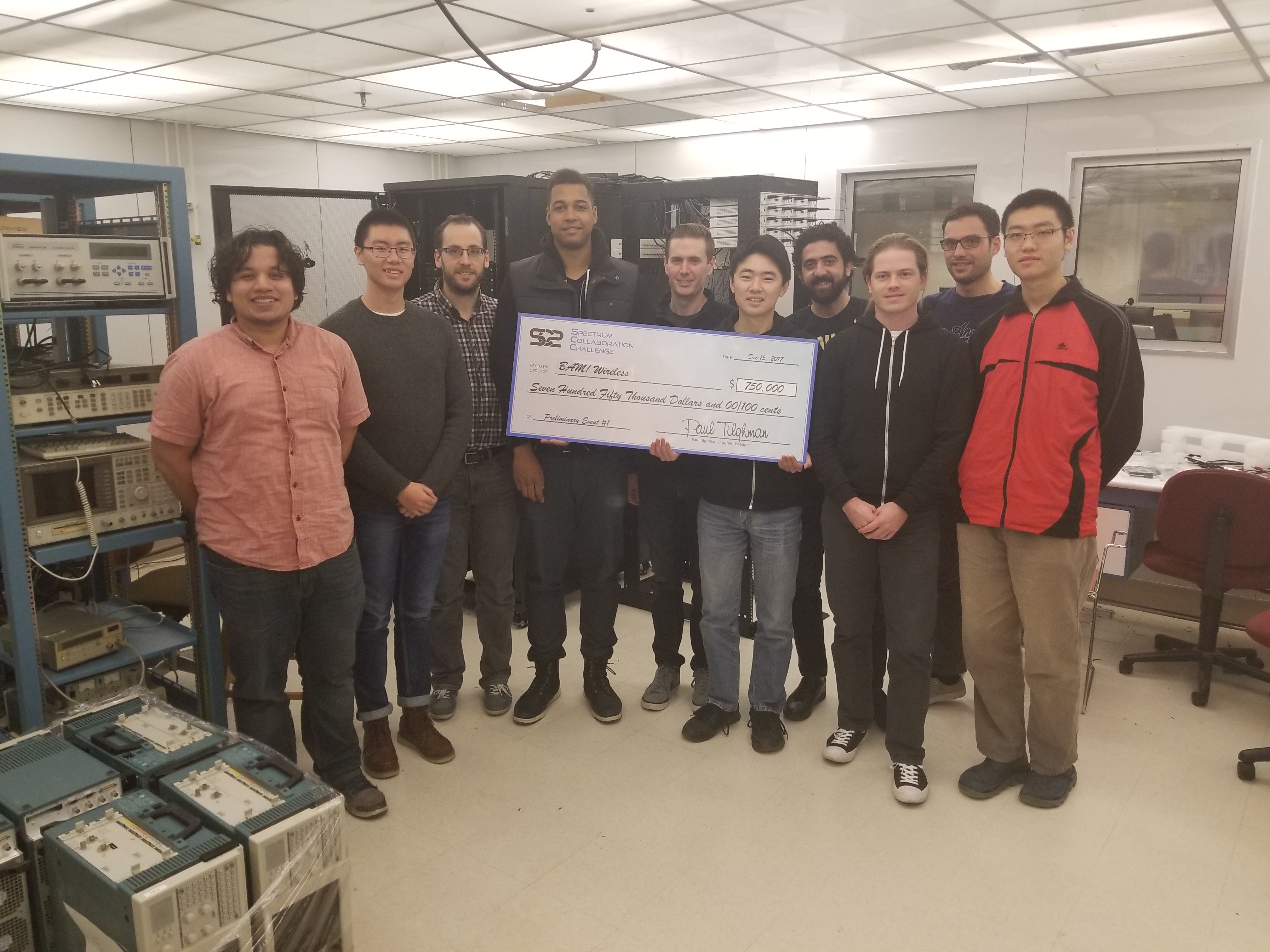 photo of Purdue SC2 team with winning check